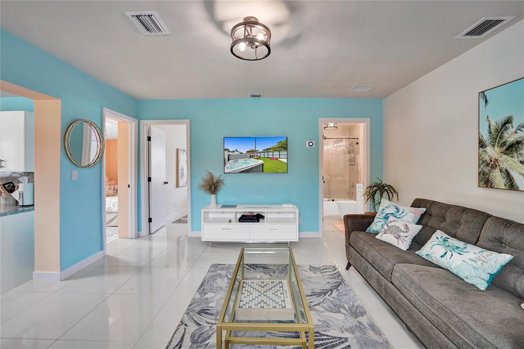 8236 Northwest 1st Place, Unit 2 Miami, FL 33150 - Photo 5 of 21 a living room with furniture and wooden floor