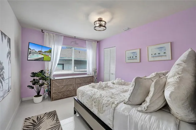 a bedroom with a bed and a couch