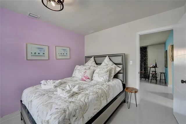 a bed room with a bed and a table