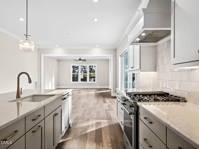 a kitchen with sink and stove