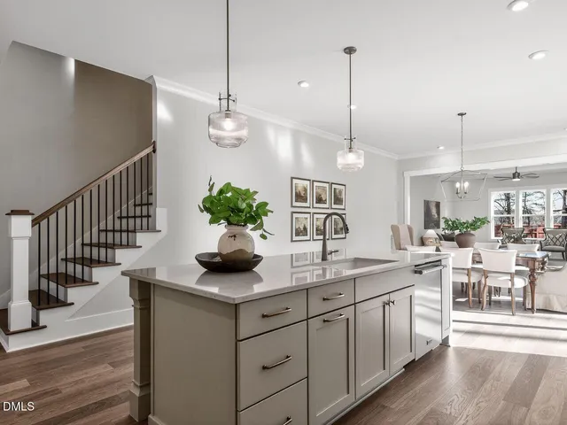 a kitchen with sink and cabinets