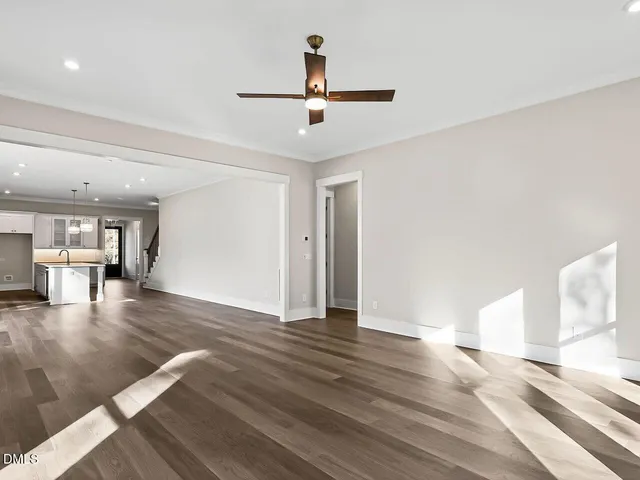 a view of livingroom with hardwood floor and ceiling fan