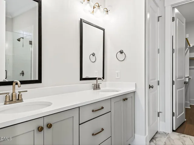a bathroom with a sink vanity and a mirror