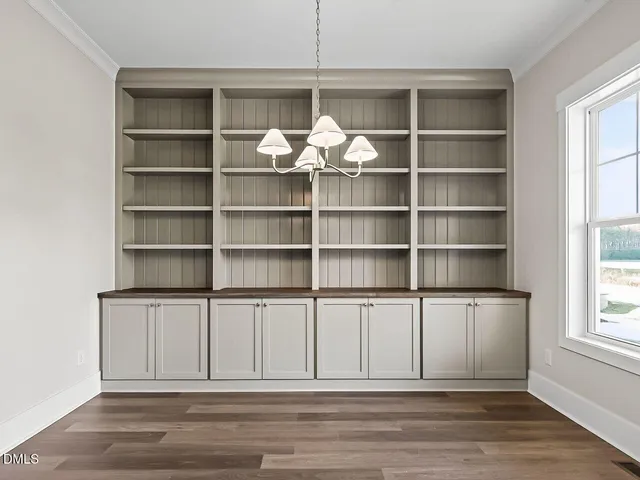 a view of a livingroom with a book shelf