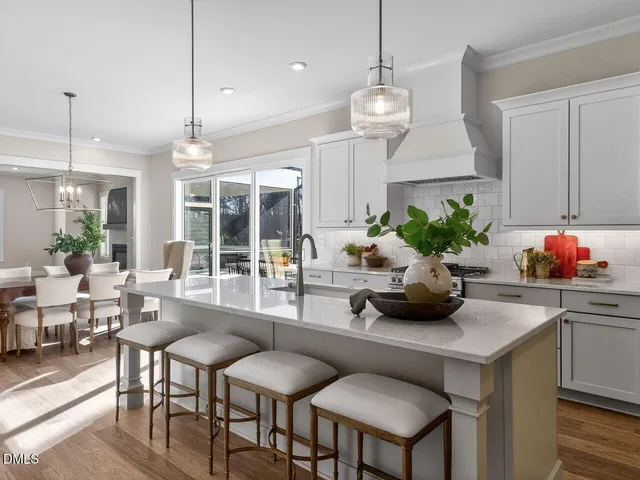 a kitchen with a chandelier furniture and a chandelier