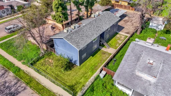 a aerial view of a house with a yard and plants