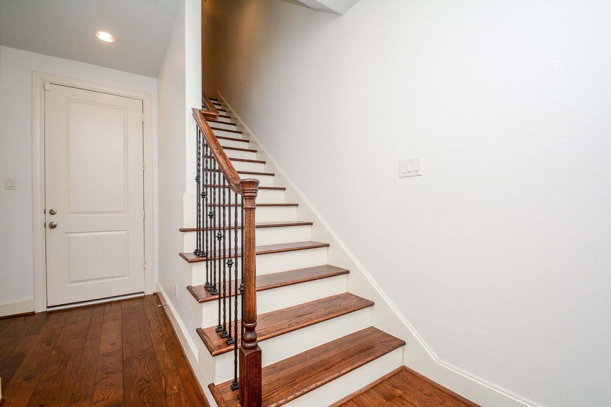 2960 Rusk Street Houston, TX 77003 - Photo 10 of 25 Entrance hallway, foyer. Door to the garage on left, stairway going to the second level on right.