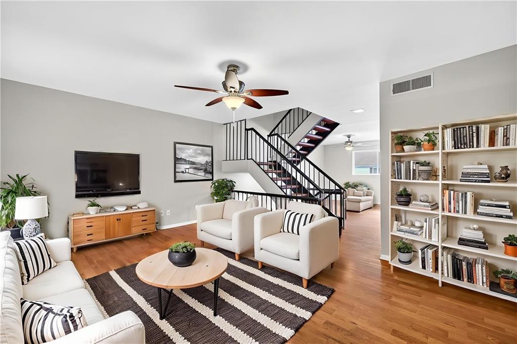 7321 Cardigan Circle Atlanta, GA 30328 - Photo 1 of 1 a living room with furniture and a flat screen tv