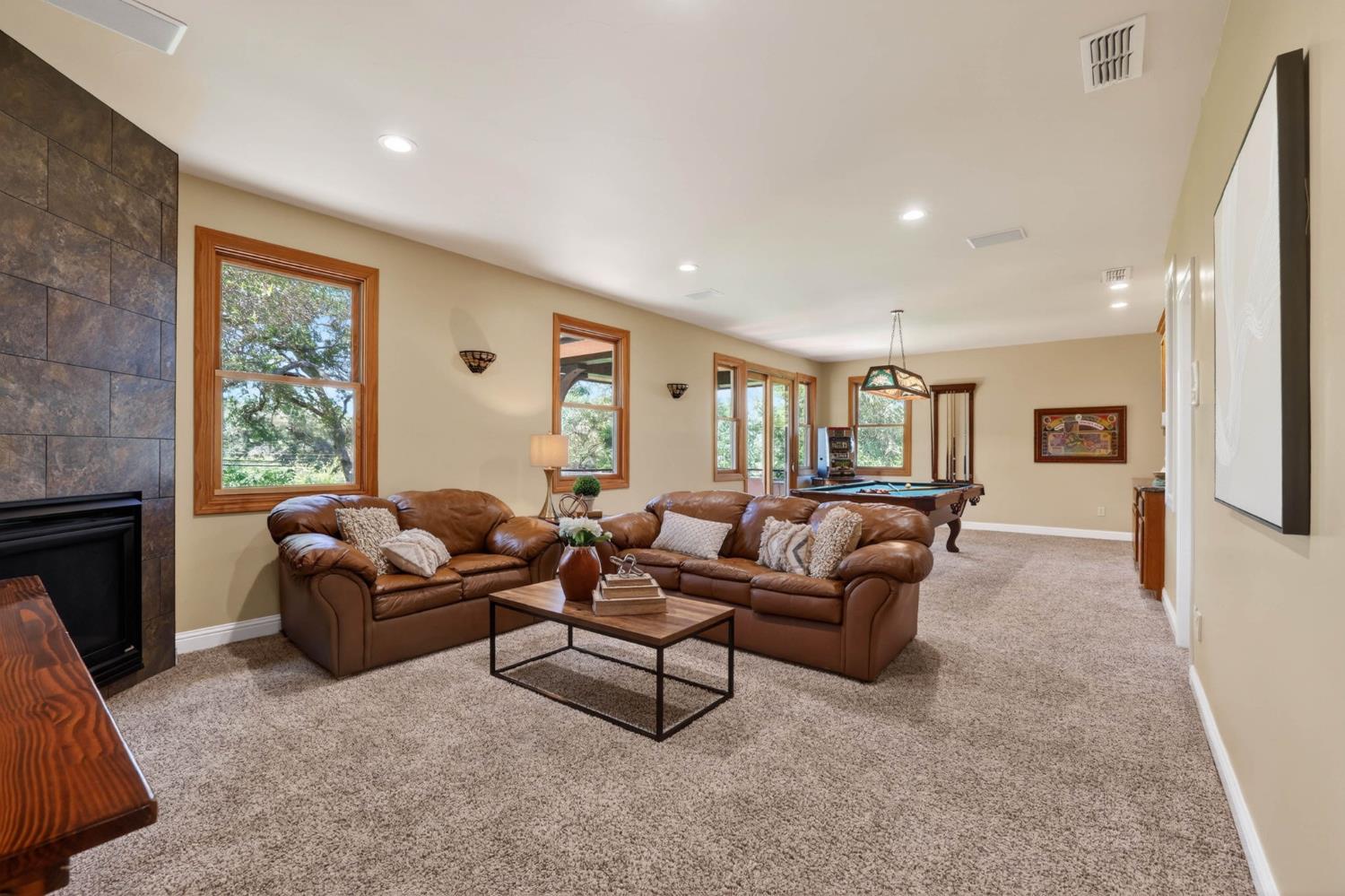 7021 Horseshoe Bar Road Loomis, CA 95650 - Photo 37 of 77 a living room with furniture and a fireplace