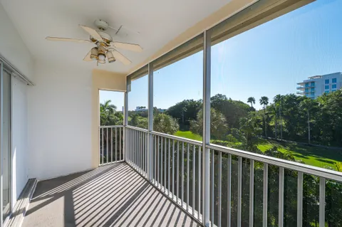 a view of a balcony with wooden floor