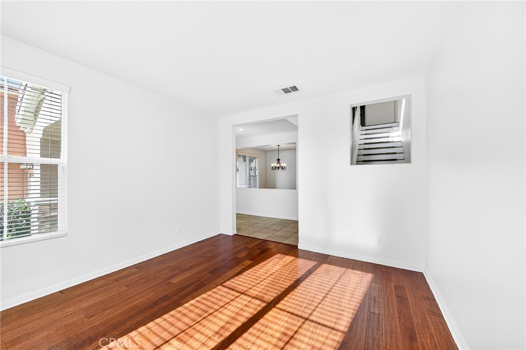 13740 Santa Maria Drive Rancho Cucamonga, CA 91739 - Photo 12 of 53 a view of a big room with wooden floor and windows