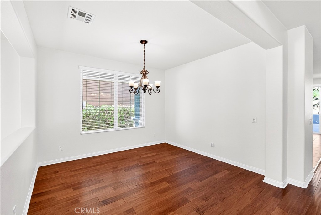 13740 Santa Maria Drive Rancho Cucamonga, CA 91739 - Photo 13 of 53 a view of a room with windows and wooden floor
