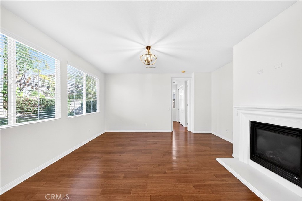 13740 Santa Maria Drive Rancho Cucamonga, CA 91739 - Photo 17 of 53 an empty room with windows and fireplace