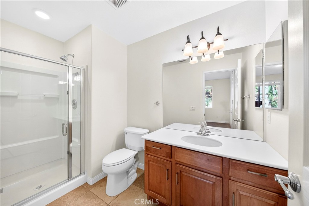 13740 Santa Maria Drive Rancho Cucamonga, CA 91739 - Photo 26 of 53 a bathroom with a toilet sink and shower
