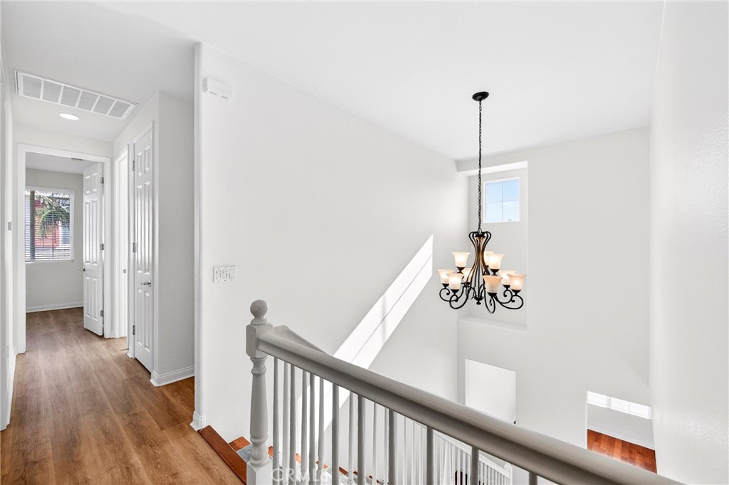 13740 Santa Maria Drive Rancho Cucamonga, CA 91739 - Photo 28 of 53 a view of a hallway with wooden floor