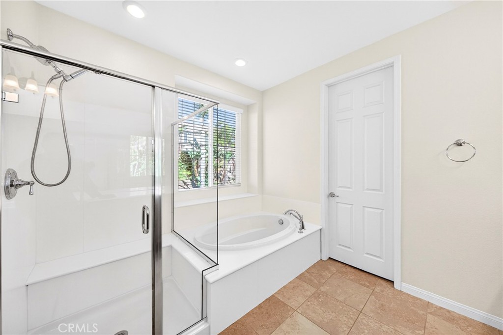 13740 Santa Maria Drive Rancho Cucamonga, CA 91739 - Photo 36 of 53 a bathroom with a bathtub and a shower