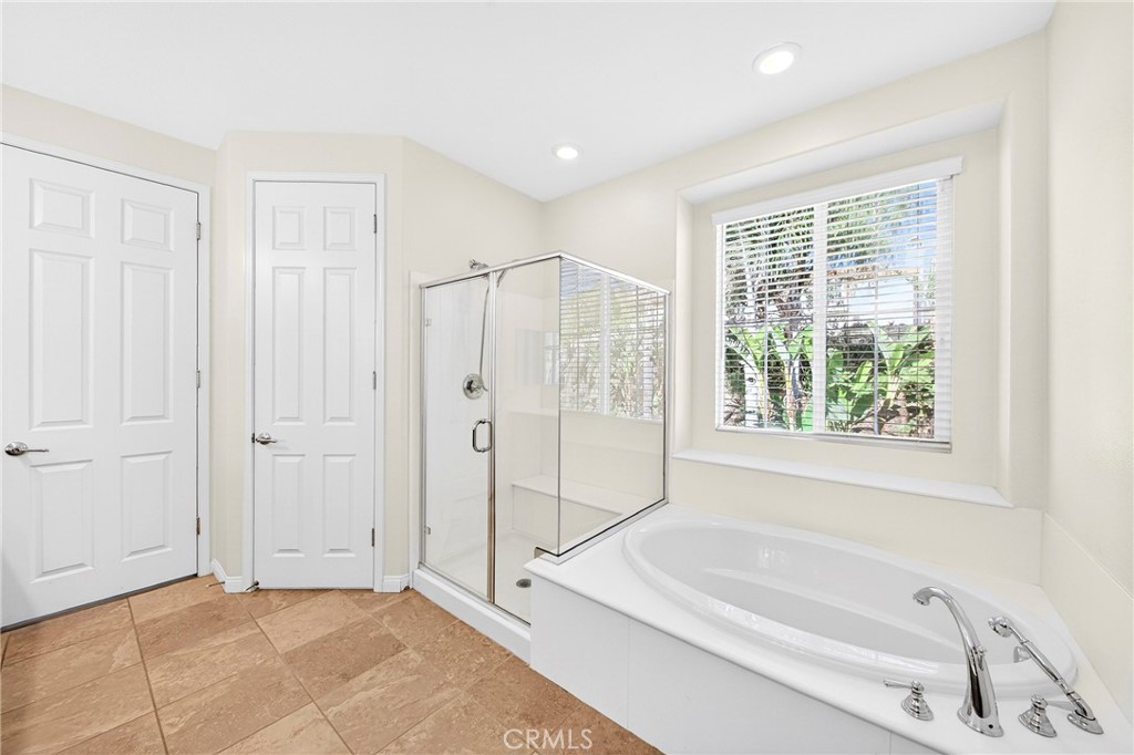 13740 Santa Maria Drive Rancho Cucamonga, CA 91739 - Photo 37 of 53 a bathroom with a bathtub and a shower