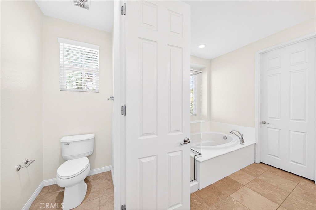 13740 Santa Maria Drive Rancho Cucamonga, CA 91739 - Photo 40 of 53 a bathroom with a toilet a sink and bathtub