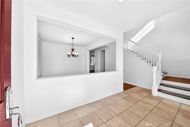 a view of entryway with wooden floor and stairs