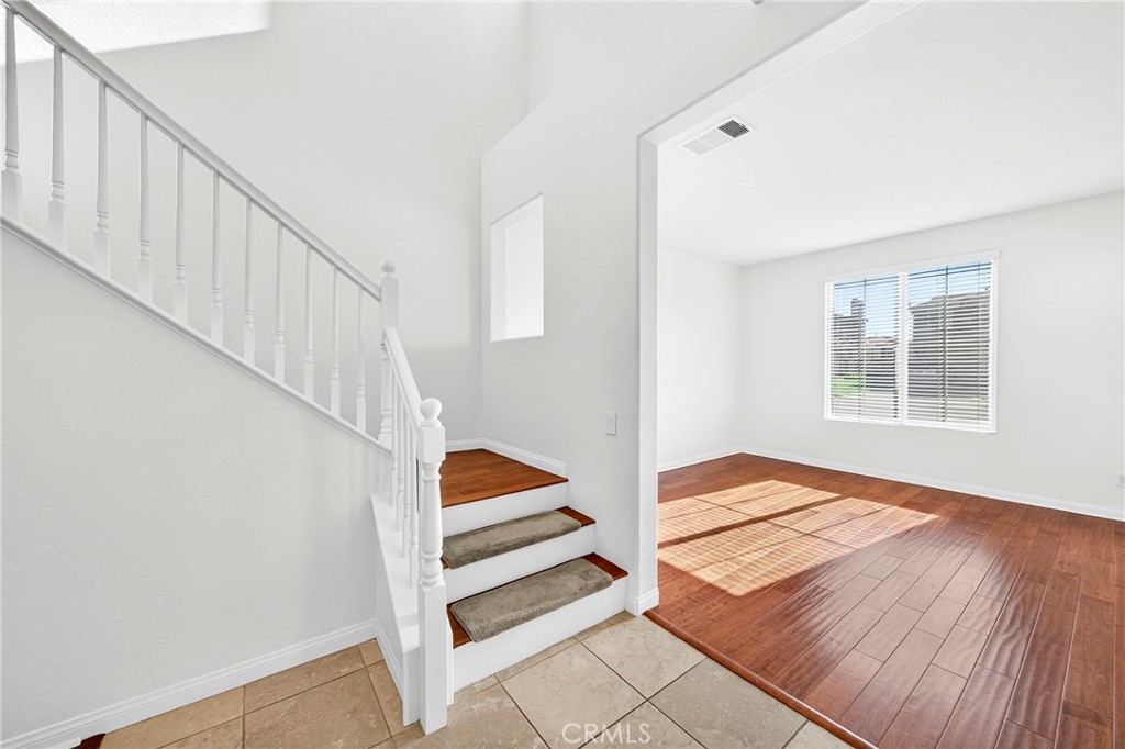 13740 Santa Maria Drive Rancho Cucamonga, CA 91739 - Photo 10 of 53 a view of entryway with wooden floor and stairs