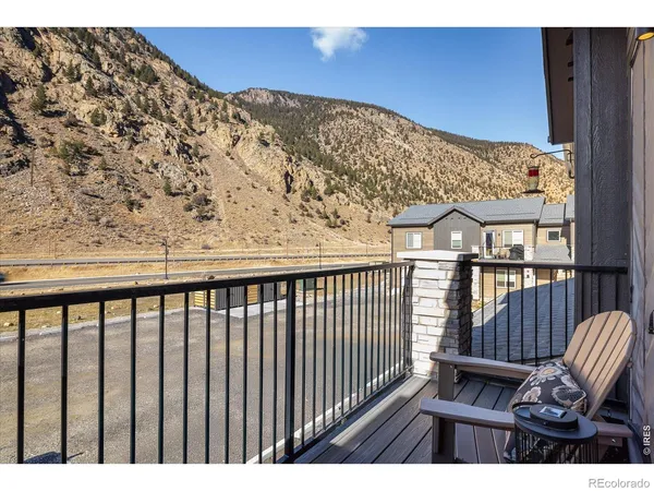 a view of balcony with wooden floor