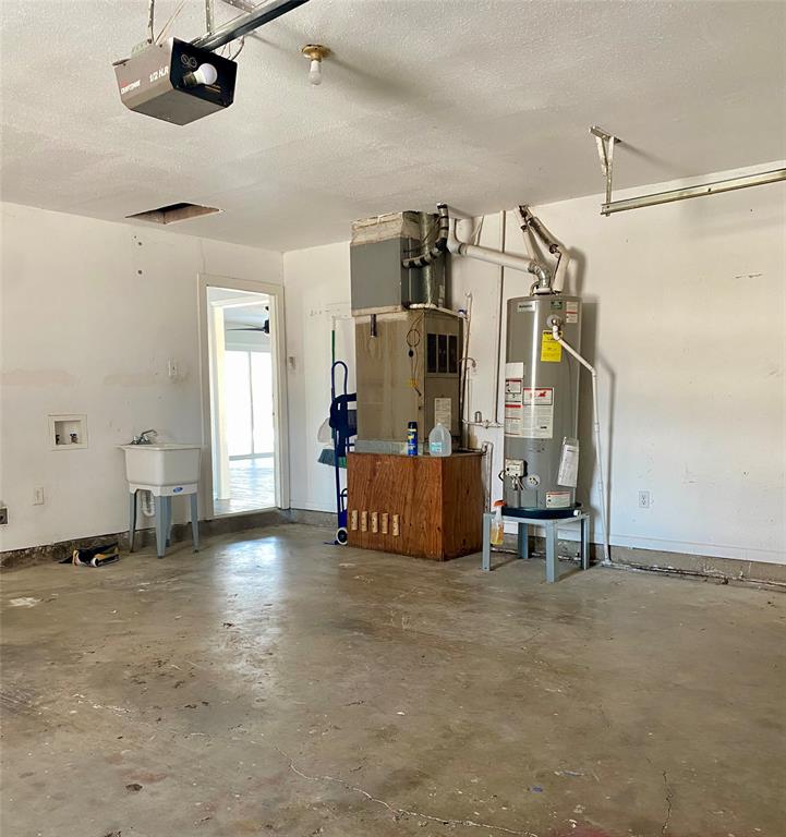 2004 Blue Bird Circle Bonham, TX 75418 - Photo 31 of 31 HVAC and water heater in garage