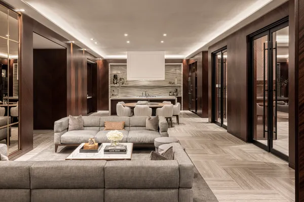 a room with stainless steel appliances kitchen island granite countertop a dining table and chairs