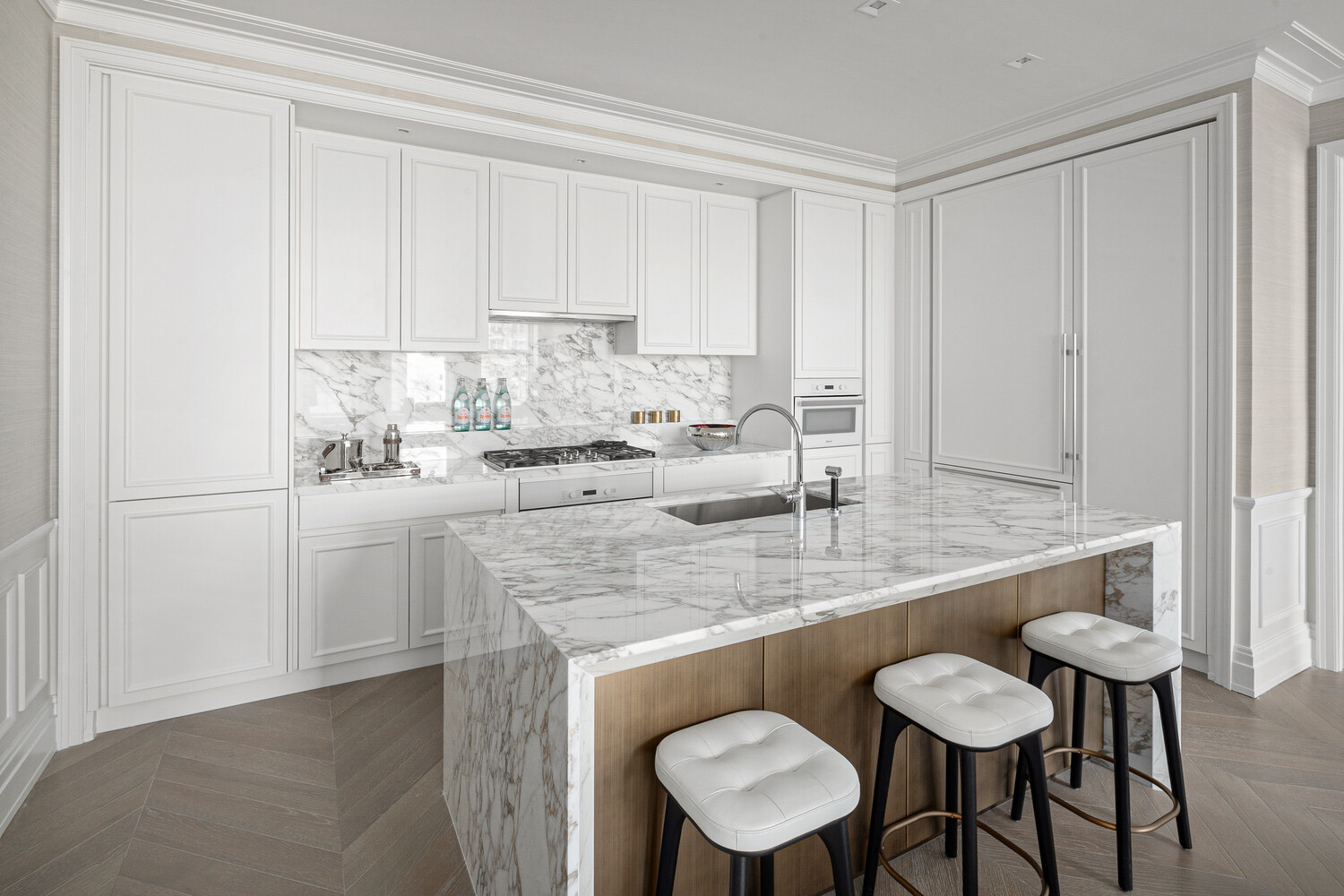 108 Leonard Street, Unit 7G Manhattan, NY 10013 - Photo 5 of 28 a kitchen with stainless steel appliances granite countertop a sink and white cabinets with wooden floor