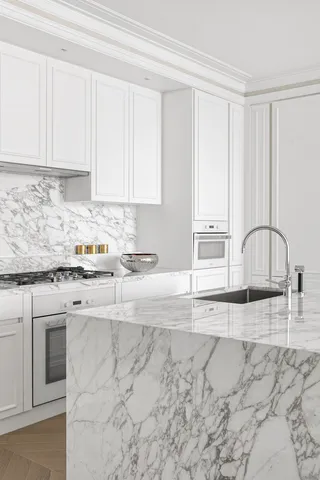 a kitchen with stainless steel appliances granite countertop a sink and white cabinets with wooden floor