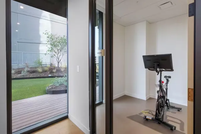 a view of a hallway with a room