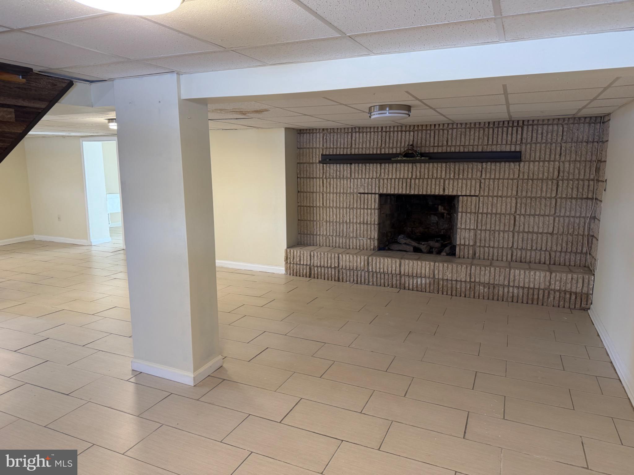 7 Rutherford Road Harrisburg, PA 17109 - Photo 20 of 20 Spacious basement with cozy fireplace.