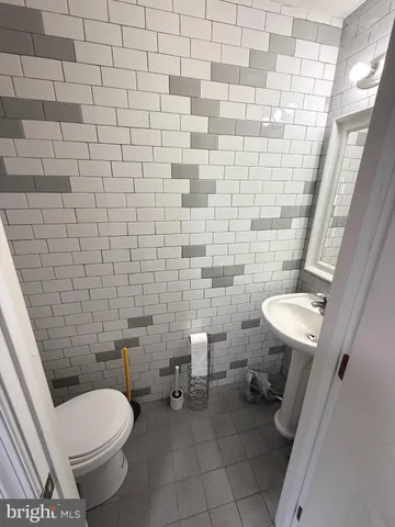 a bathroom with a toilet and a sink