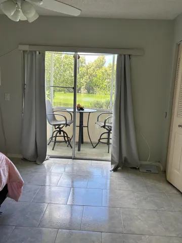 a view of a livingroom with furniture and staircase