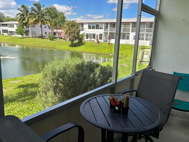 a view of a chairs and table in patio