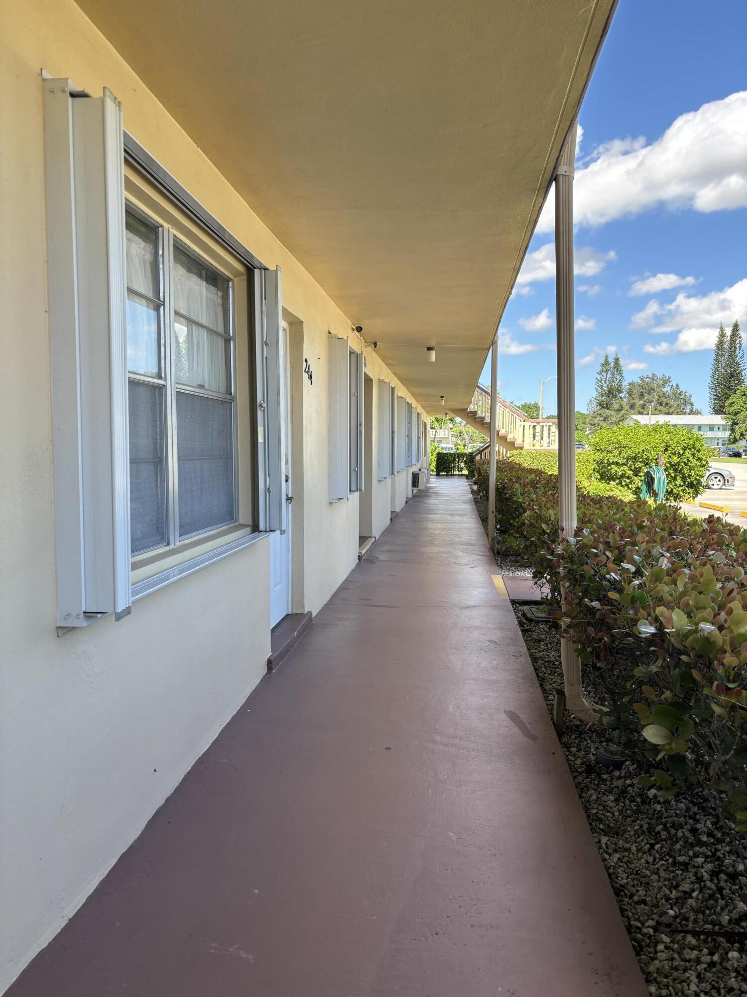 243 Northampton M, Unit 243 West Palm Beach, FL 33417 - Photo 15 of 15 a view of a large trees with stairs