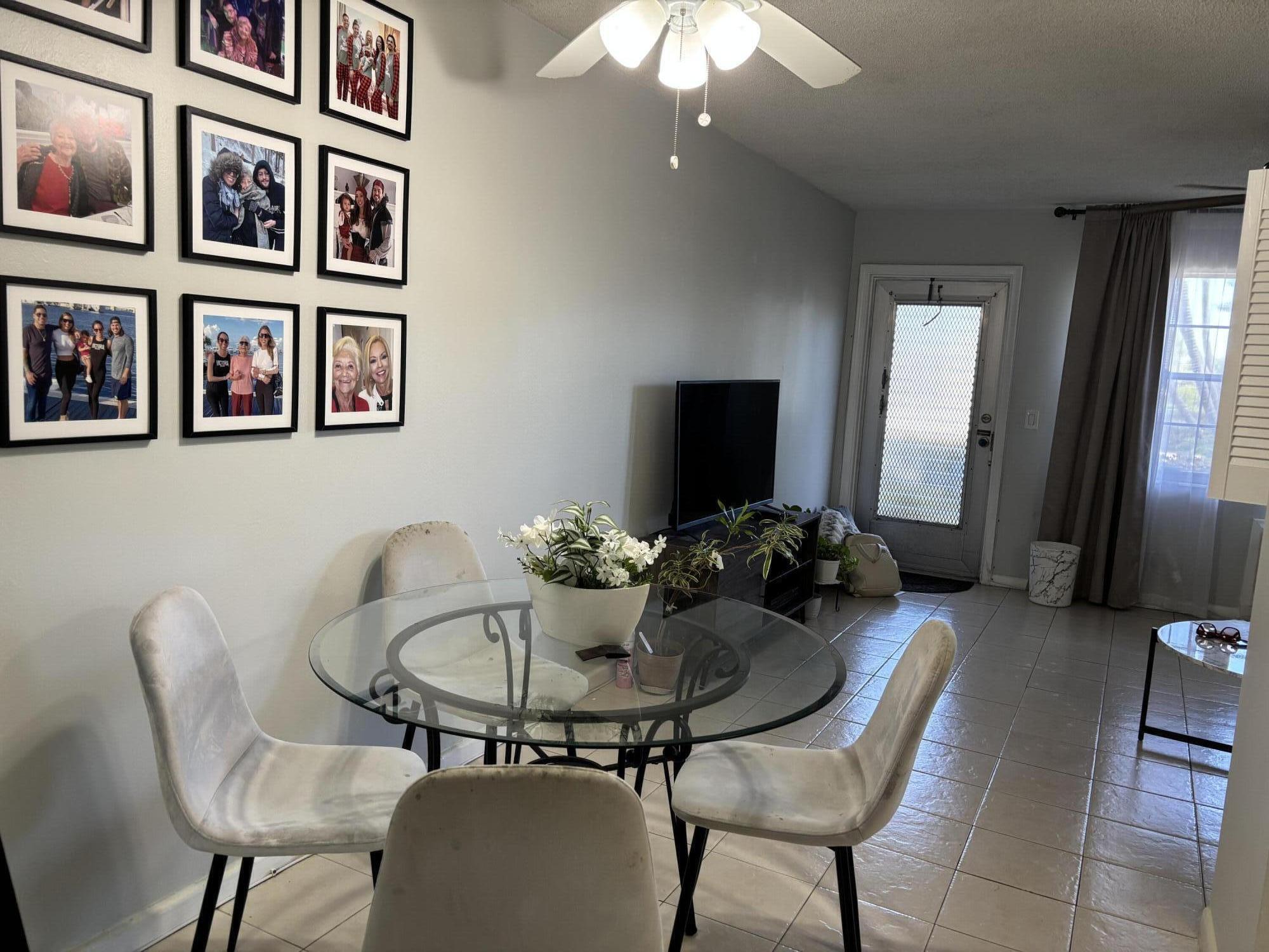 243 Northampton M, Unit 243 West Palm Beach, FL 33417 - Photo 4 of 15 a dining room with furniture and window