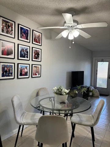 a work room with furniture and a bookshelf