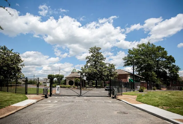 a view of a park with swings and slides