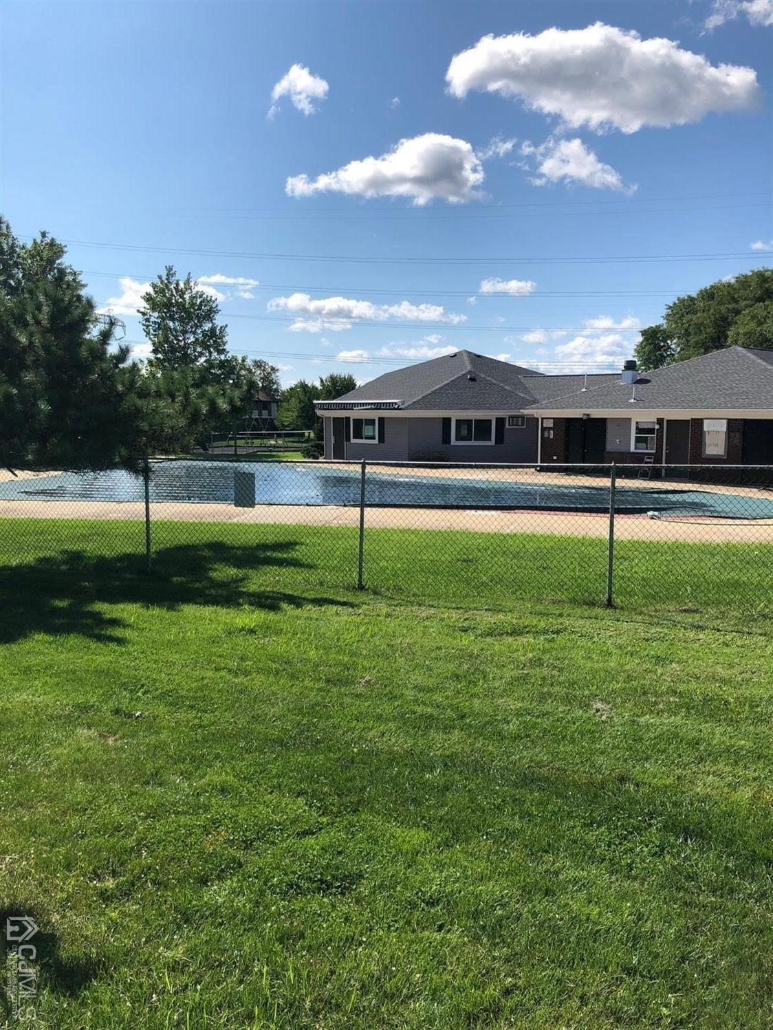 880 Robin Road Hillsborough, NJ 08844 - Photo 14 of 37 a swimming pool with lots of tress in front of it