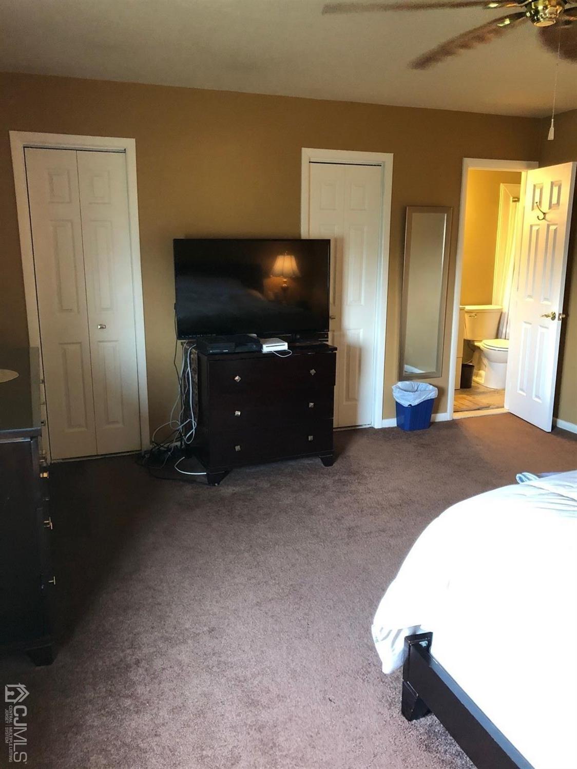 880 Robin Road Hillsborough, NJ 08844 - Photo 26 of 37 a living room with furniture and a flat screen tv