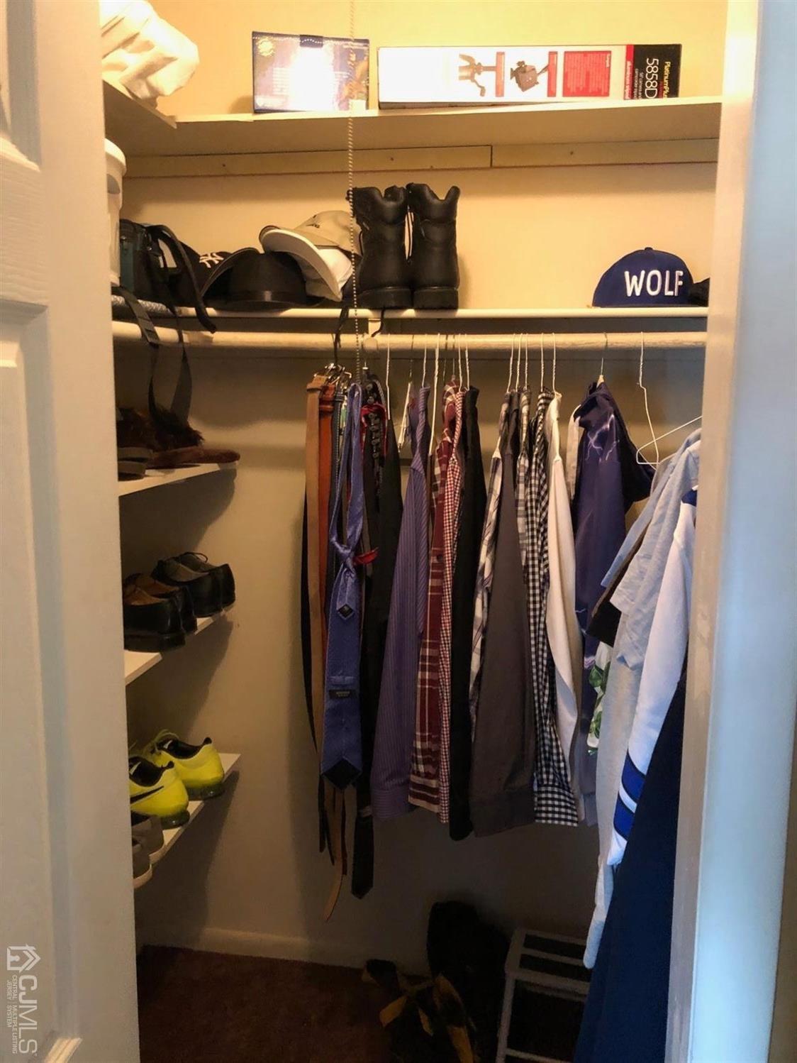 880 Robin Road Hillsborough, NJ 08844 - Photo 30 of 37 a view of walk in closet with clothes and shoes