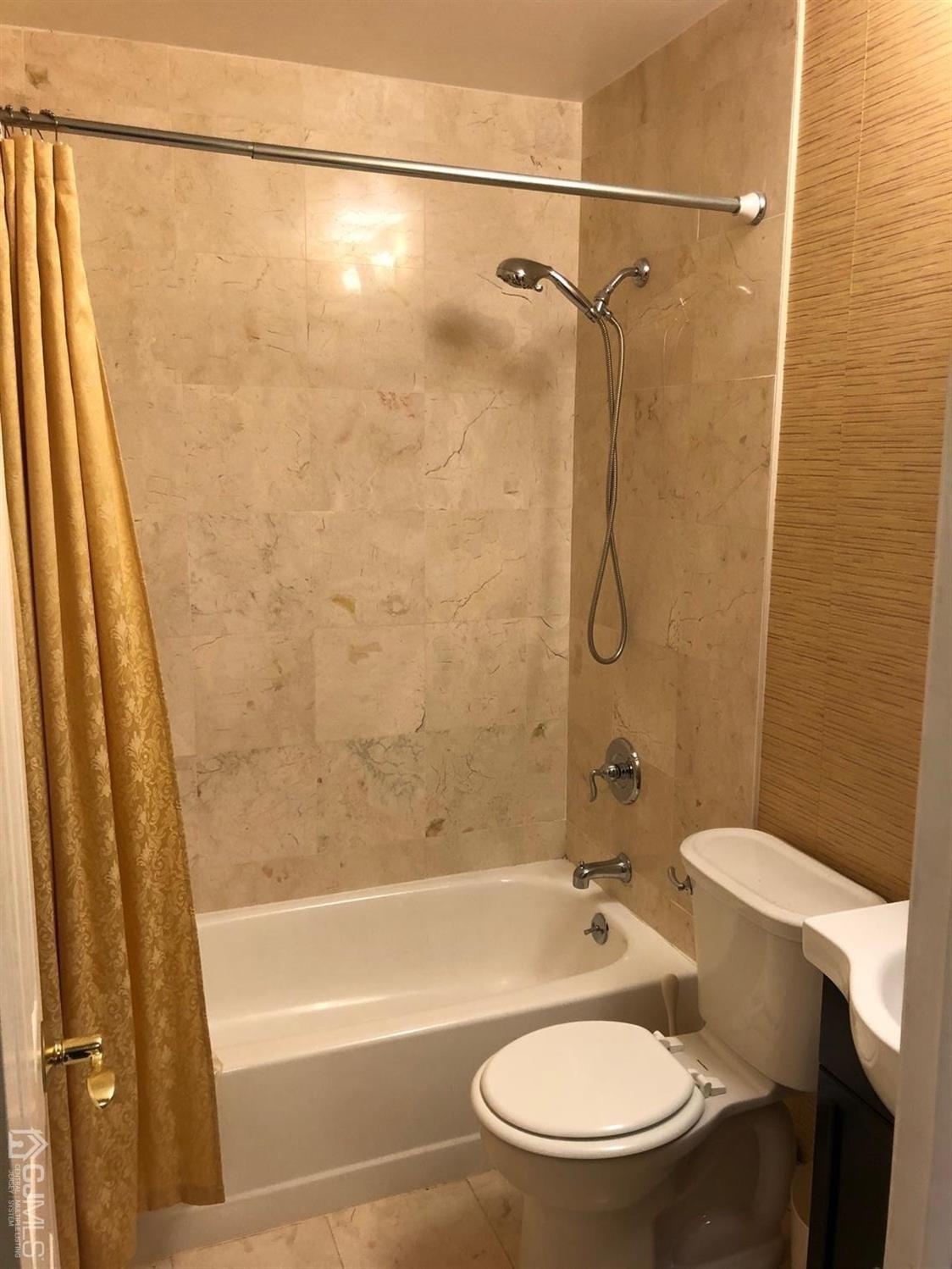 880 Robin Road Hillsborough, NJ 08844 - Photo 35 of 37 a bathroom with a granite countertop bathtub shower sink vanity and toilet
