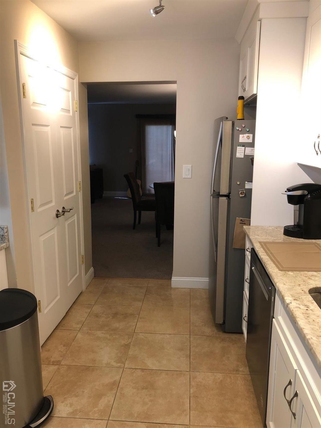 880 Robin Road Hillsborough, NJ 08844 - Photo 6 of 37 a view of kitchen with furniture and refrigerator
