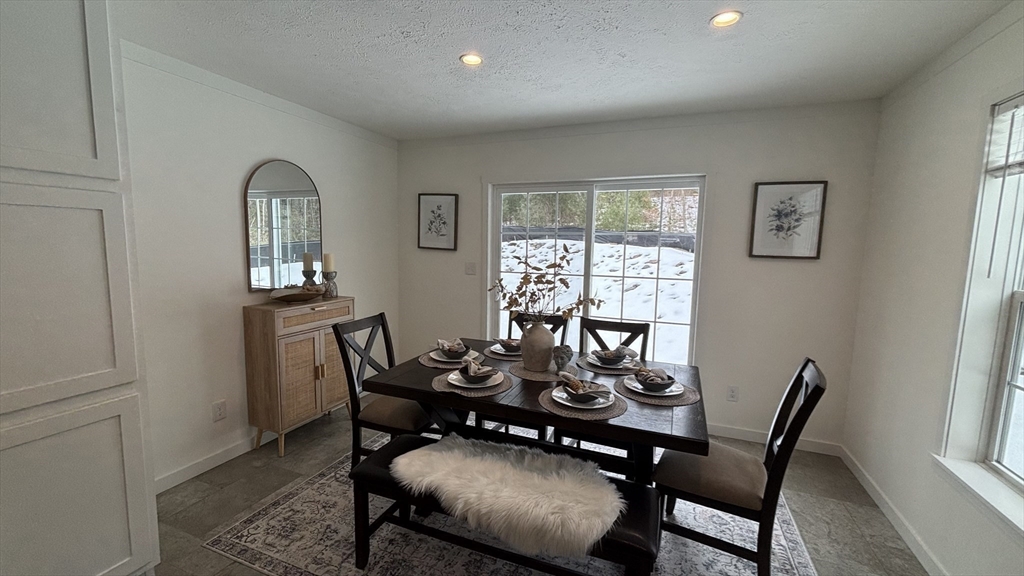 6 Berry Farms Road, Unit 6 Sturbridge, MA 01566 - Photo 7 of 16 a view of a dining room with furniture window and outside view