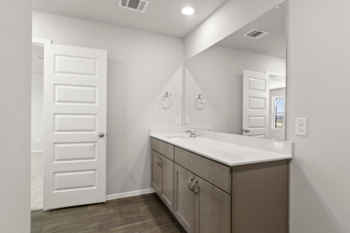 230 Barley Lane Elgin, TX 78621 - Photo 31 of 39 a bathroom with a sink and a mirror