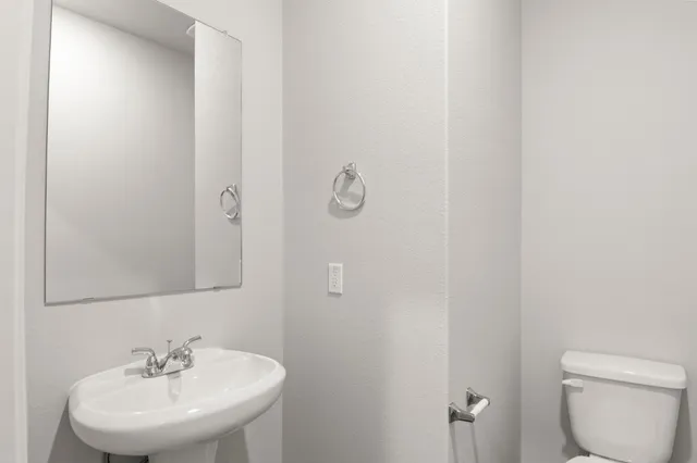 a view of a house with a yard and more windows