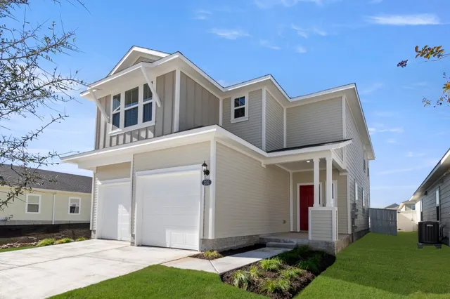 a view of a tennis ground with large trees