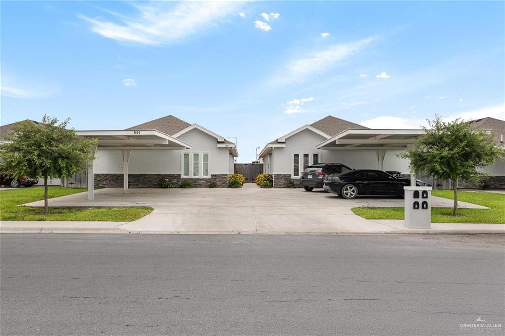 1804 Stauffer Street Weslaco, TX 78596 - Photo 1 of 23 a view of house with a garden and pathway