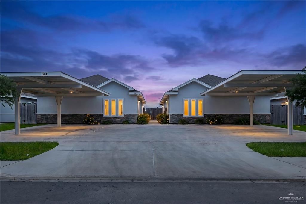 1804 Stauffer Street Weslaco, TX 78596 - Photo 1 of 17 a front view of a house with a yard and garage