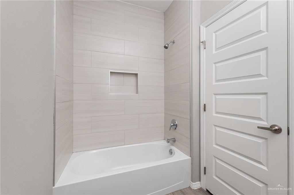 1804 Stauffer Street Weslaco, TX 78596 - Photo 12 of 23 a bathroom with a bathtub